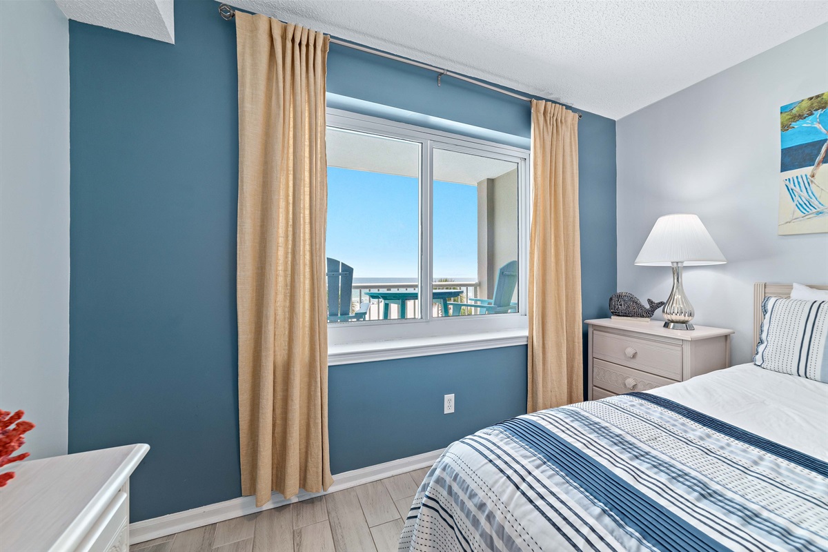 The combination of natural materials, subtle coastal accents, and abundant natural light creates a warm and welcoming ambiance.