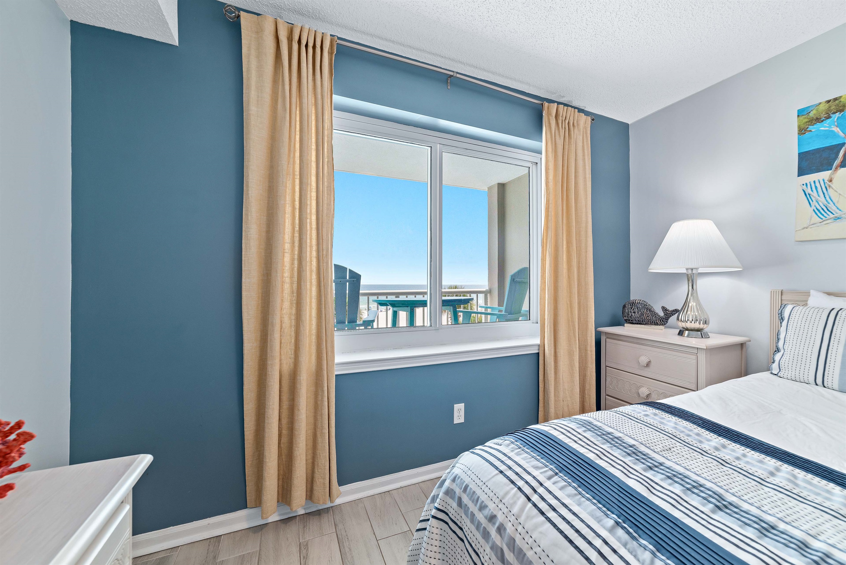 The combination of natural materials, subtle coastal accents, and abundant natural light creates a warm and welcoming ambiance.