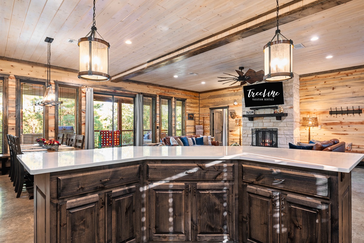 The open-plan kitchen is perfect for cooking and socializing, with plenty of counter space and natural light streaming in.