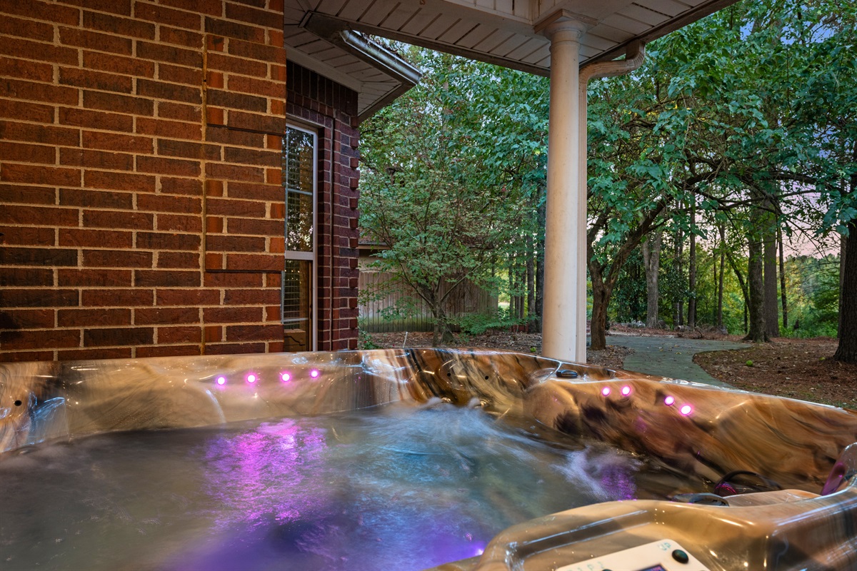 Relax in the private hot tub surrounded by nature.
