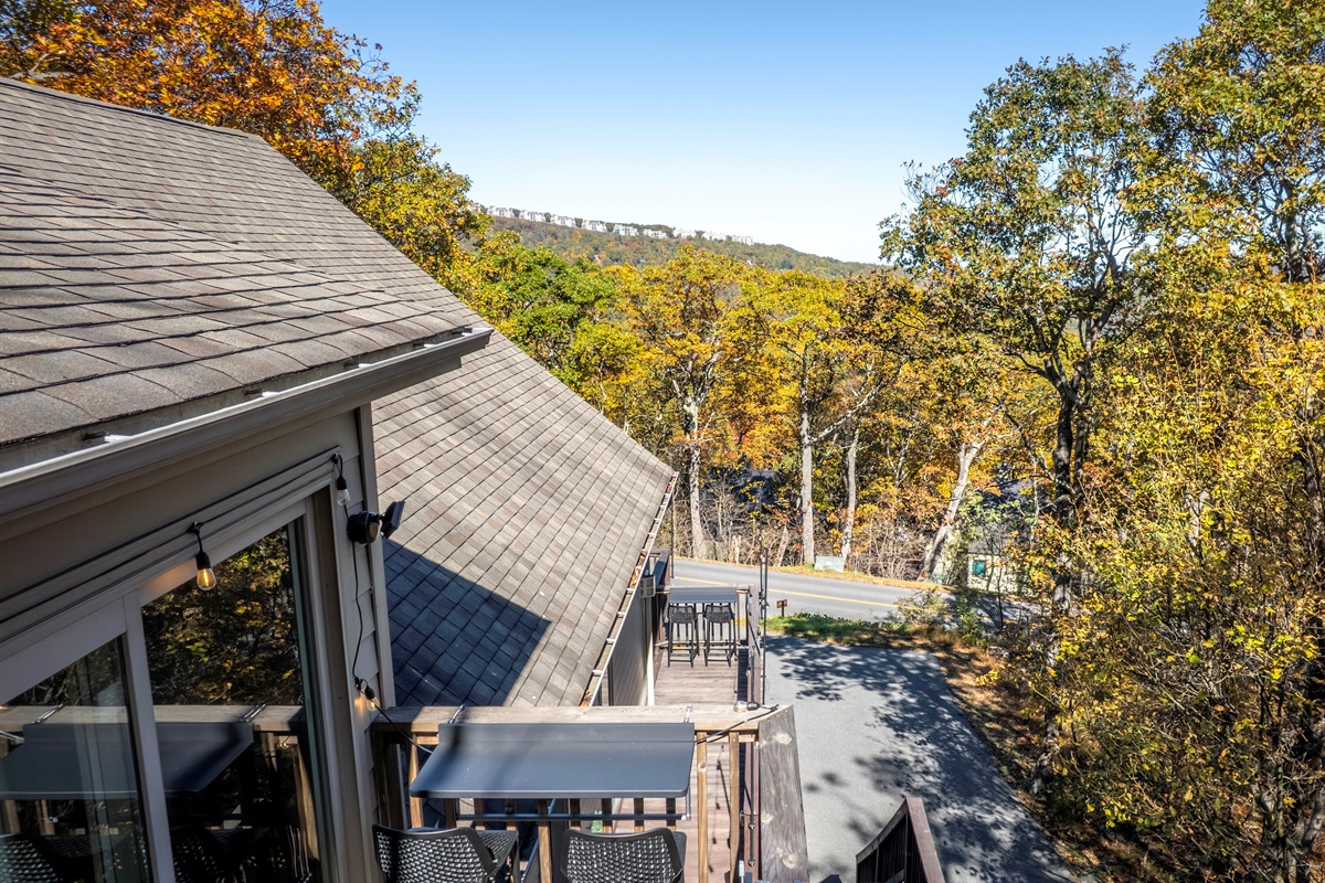 Morning view from the Vista Balcony—golden fall trees and clear skies stretch toward the Blue Ridge, showcasing beauty beyond last night’s sunset.