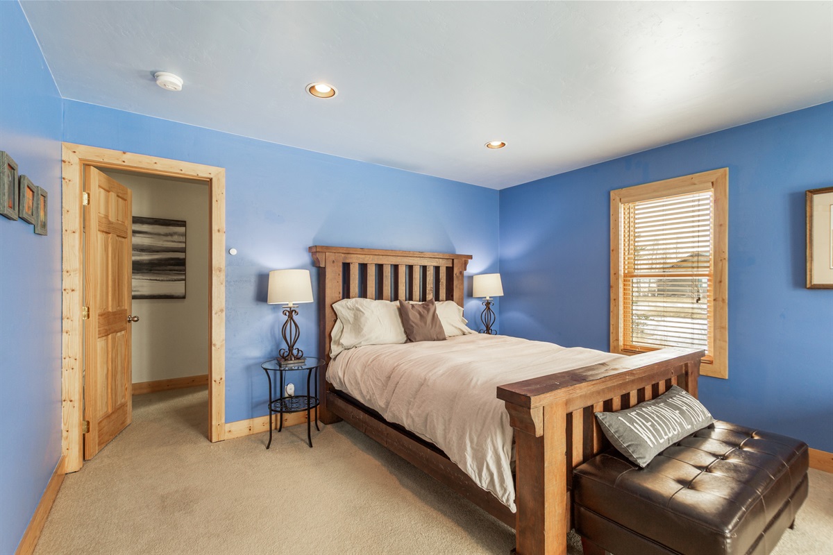 The large primary bedroom offers a queen size bed with an en suite bath.