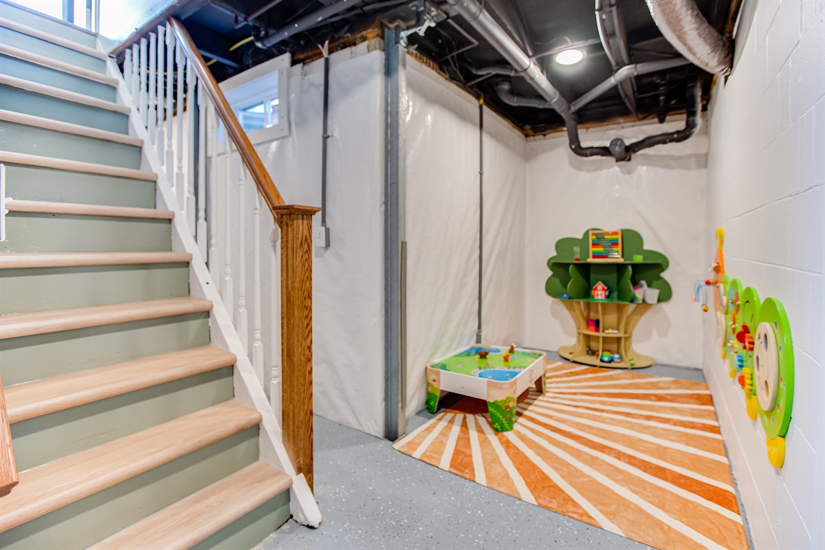 Basement toddler play area (office nook is behind stairs)