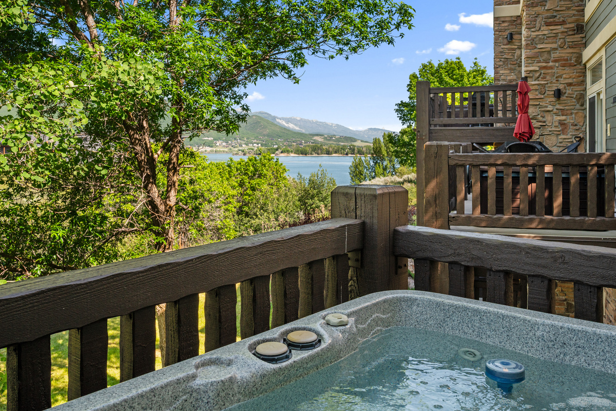 Relax in the private hot tub while enjoying breathtaking views of Pineview Reservoir and the surrounding mountains — the perfect way to unwind after a day of adventure.