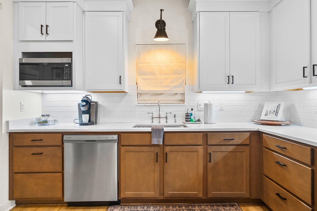 Modern kitchen setup with stylish cabinetry and convenient coffee nook.
