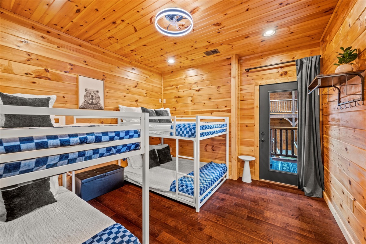 Bedroom 6 (downstairs) has a twin over twin bunk bed and a full over full bunk bed and shares a private Jack & Jill bathroom with Bedroom 7.