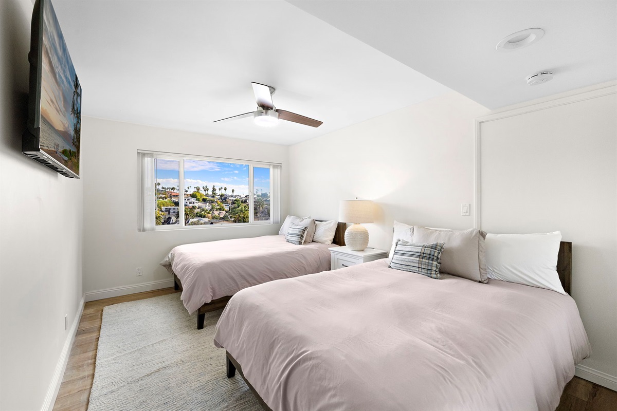 “Second bedroom featuring ultra-comfortable luxury mattresses, soft premium linens, and a calm coastal design for a great night’s sleep