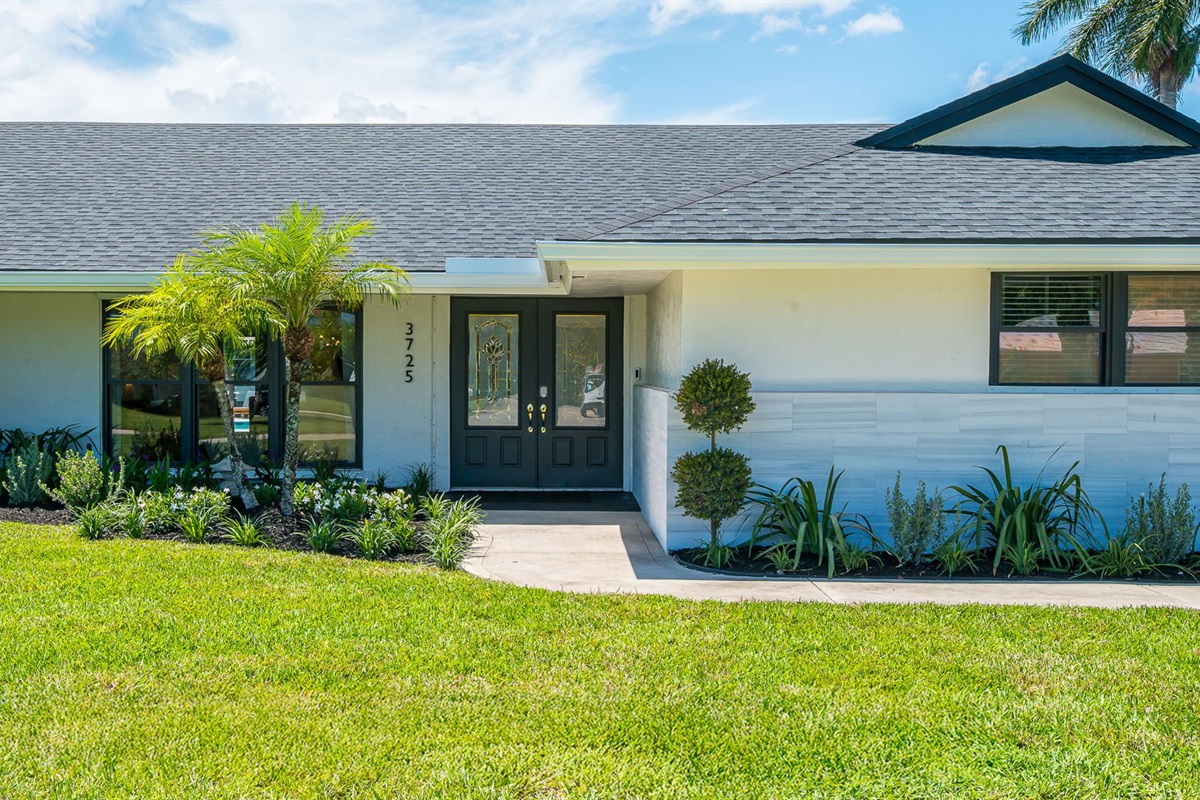 Welcome to this beautifully designed home with fresh landscaping and inviting curb appeal. The expansive driveway provides parking for up to three cars, making it ideal for families and groups. Located in a safe, family-friendly neighborhood