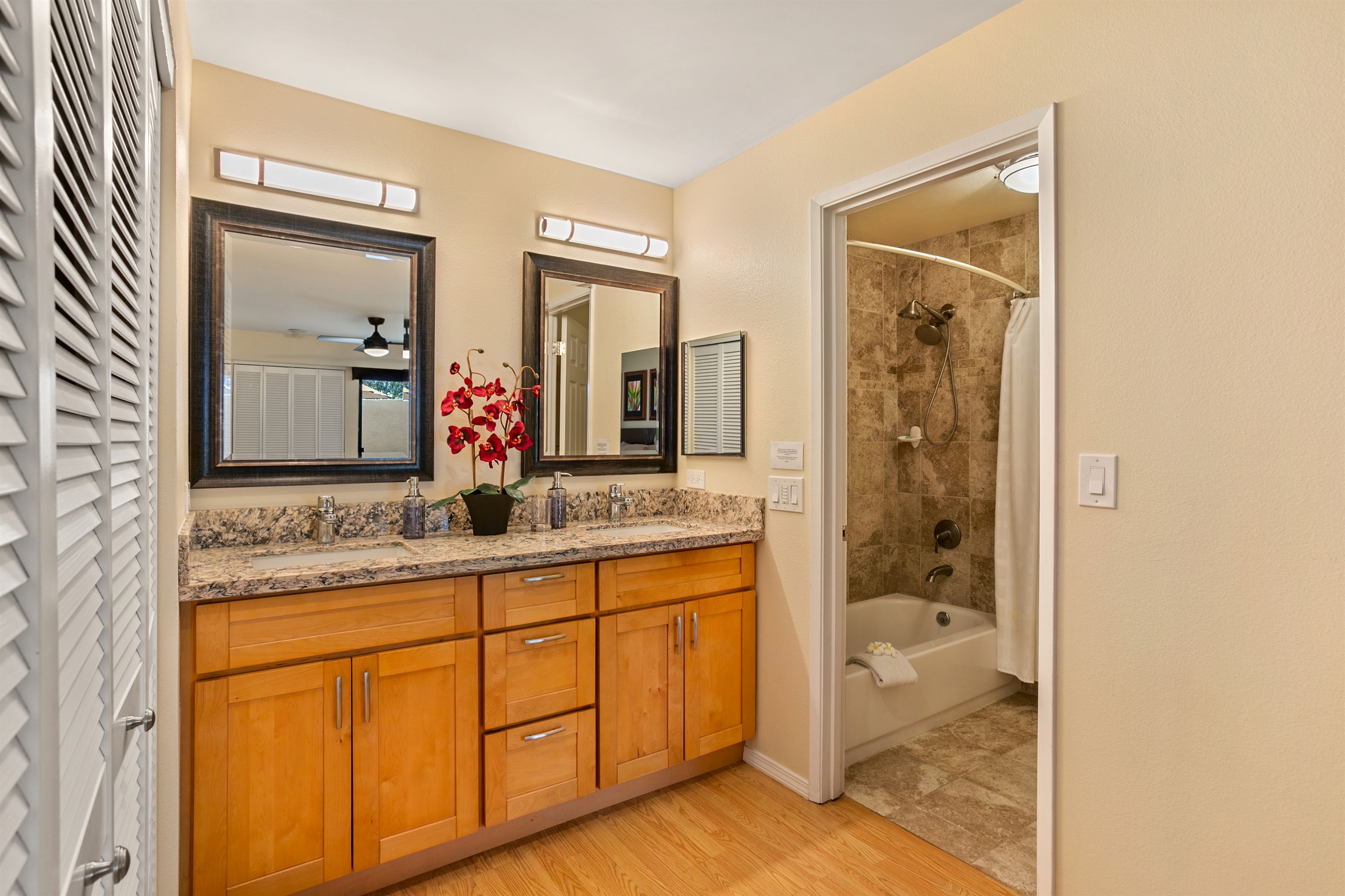 The master bath has double sinks and shower/tub combo