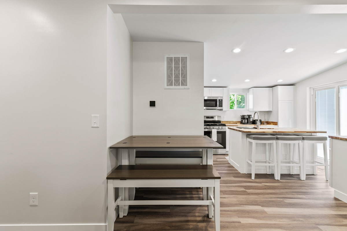 The Waterbury Way - Kitchen Table that seats 6. Seats open up for storage.