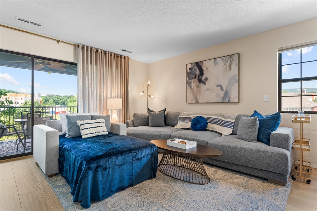🛋 Relax with style—our oversized sectional and twin sleeper offer versatile comfort, with midcentury touches and calming blue accents throughout.