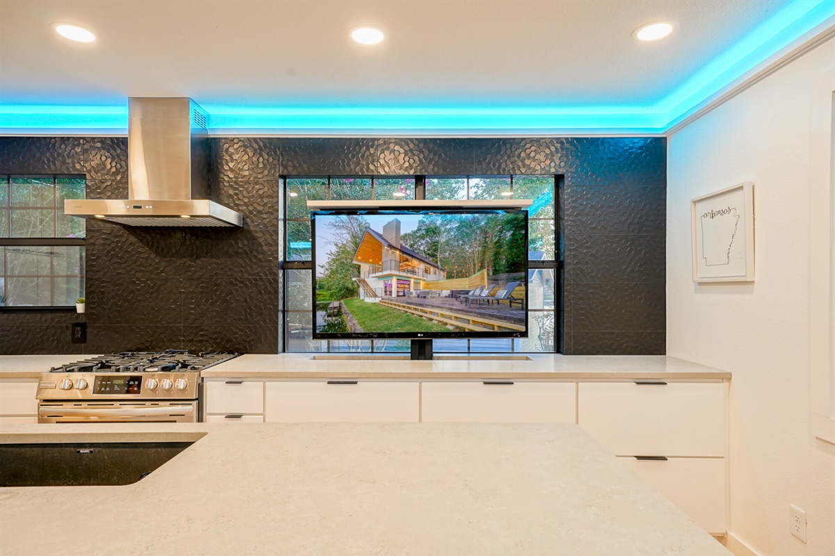 Catch the game or stream your favorites while you cook — this sleek setup combines gourmet functionality with serious fun.