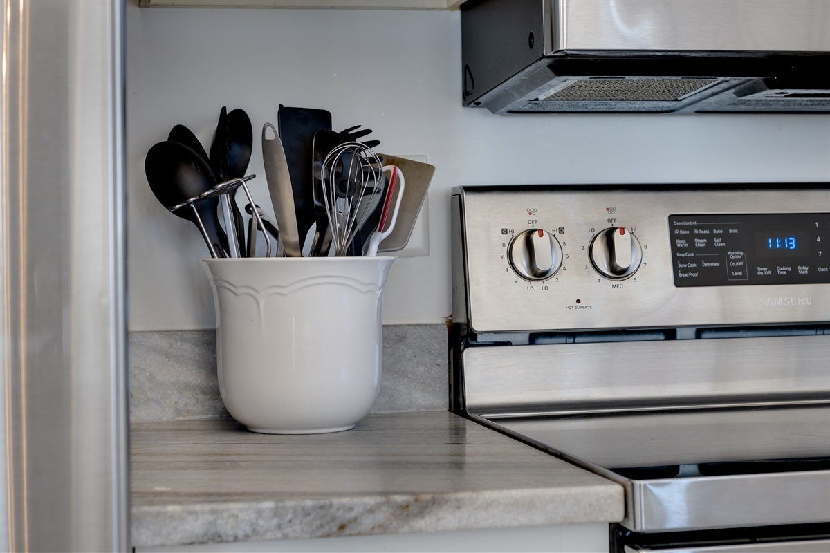 Well stocked kitchen with quality cookware and utensils