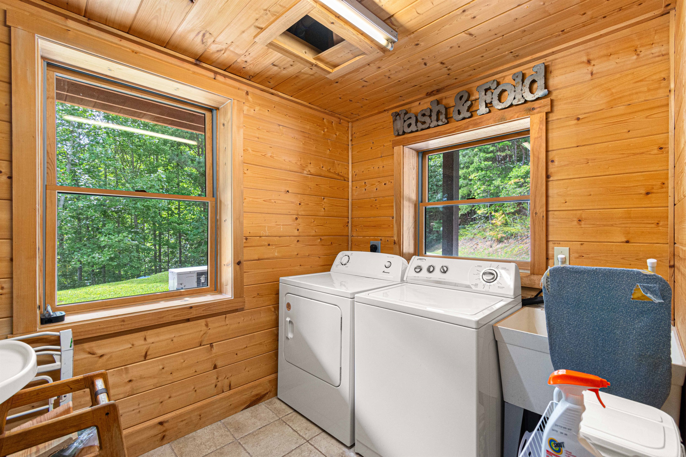 Downstairs Laundry Room: Bright and airy space with views of nature, making chores a breeze!