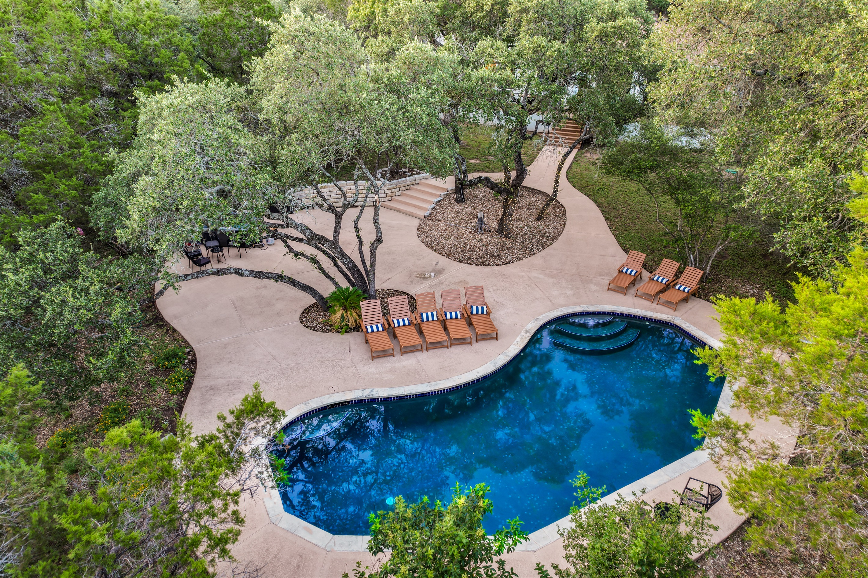 Tucked away in lush greenery, this intimate pool is ideal for a private soak or a peaceful break surrounded by trees and tranquility.