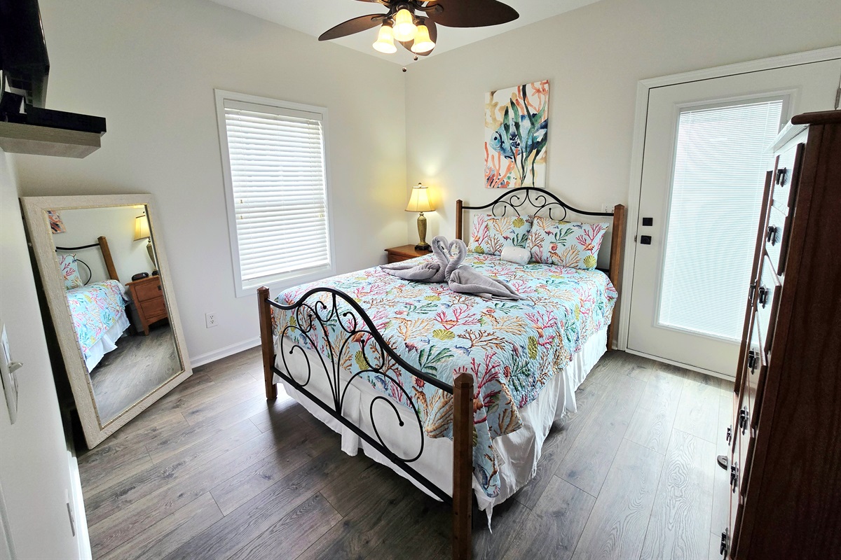 Bedroom 1 (Main Level - Queen) w/ access to balcony