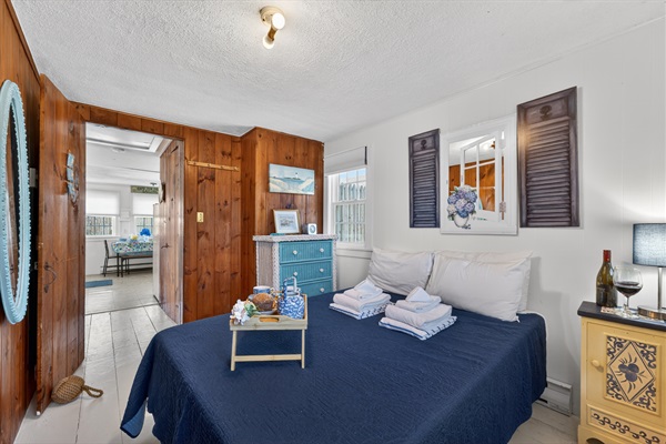 Welcome to our first bedroom! A peaceful master bedroom with a comfortable full-size bed for restful nights!