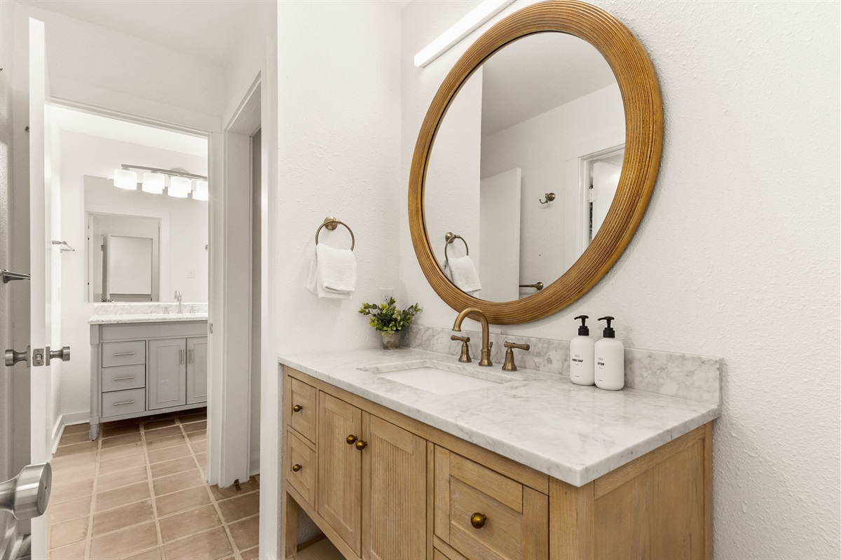 Bathroom vanity with designer mirror and lighting