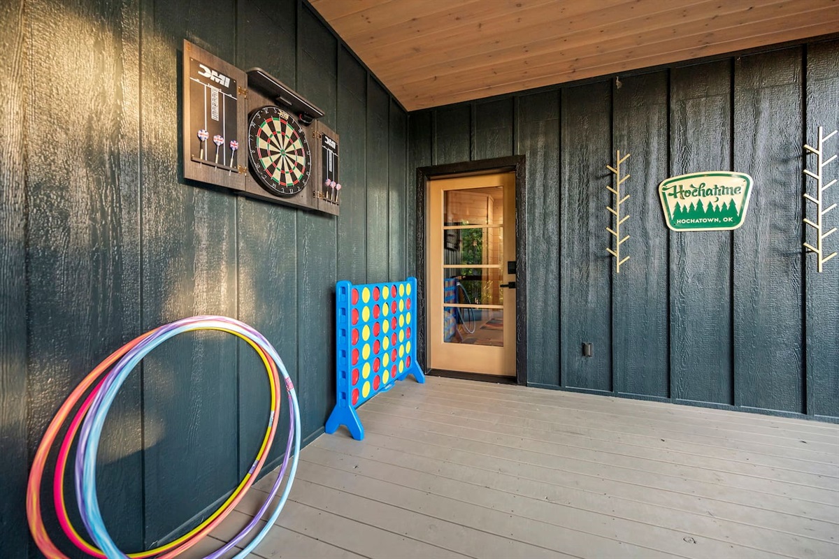 Hot tub deck comes with giant Connect 4 game, a dart board and Hula hoops for the little ones.