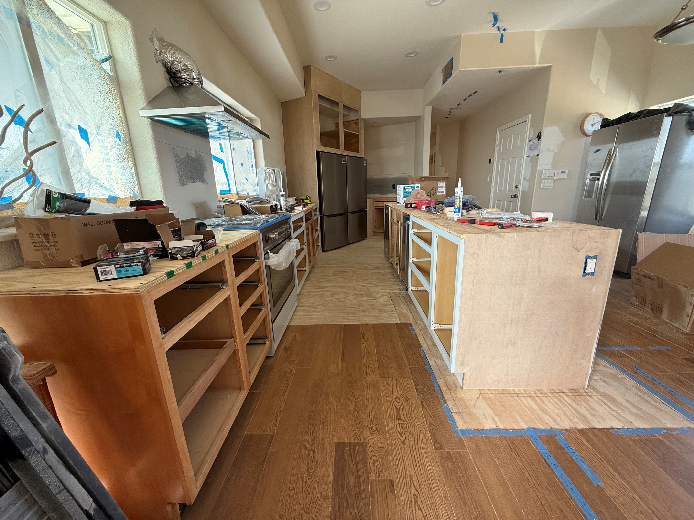 Gas Range is installed, drawers are removed to protect the fresh paint, quartz countertops are being installed this week! Plank flooring throughout!  Cabinet Paint is either first or last - so it is last on this project! 4/6/26