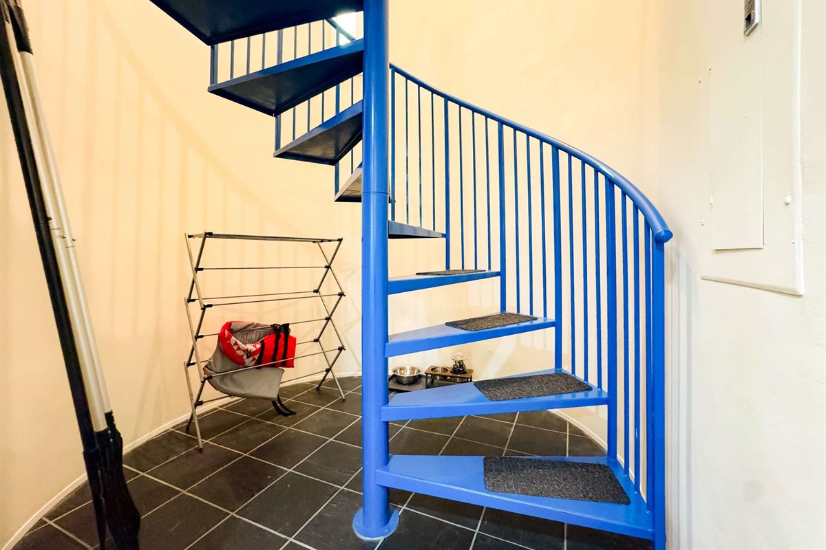Paddles for the kayaks as well as life jackets provided for your stay. The spiral staircase leads you to the two upstairs bedrooms.