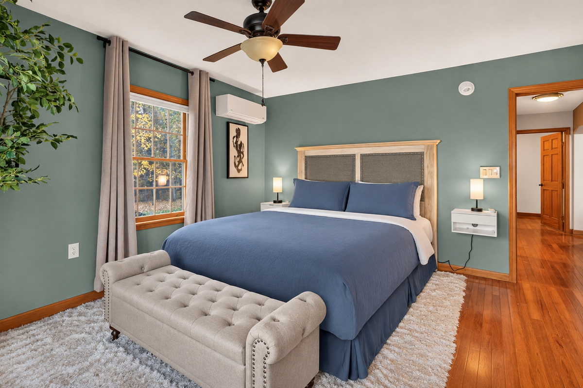 Bedroom 3 with blue bedding and upholstered bench