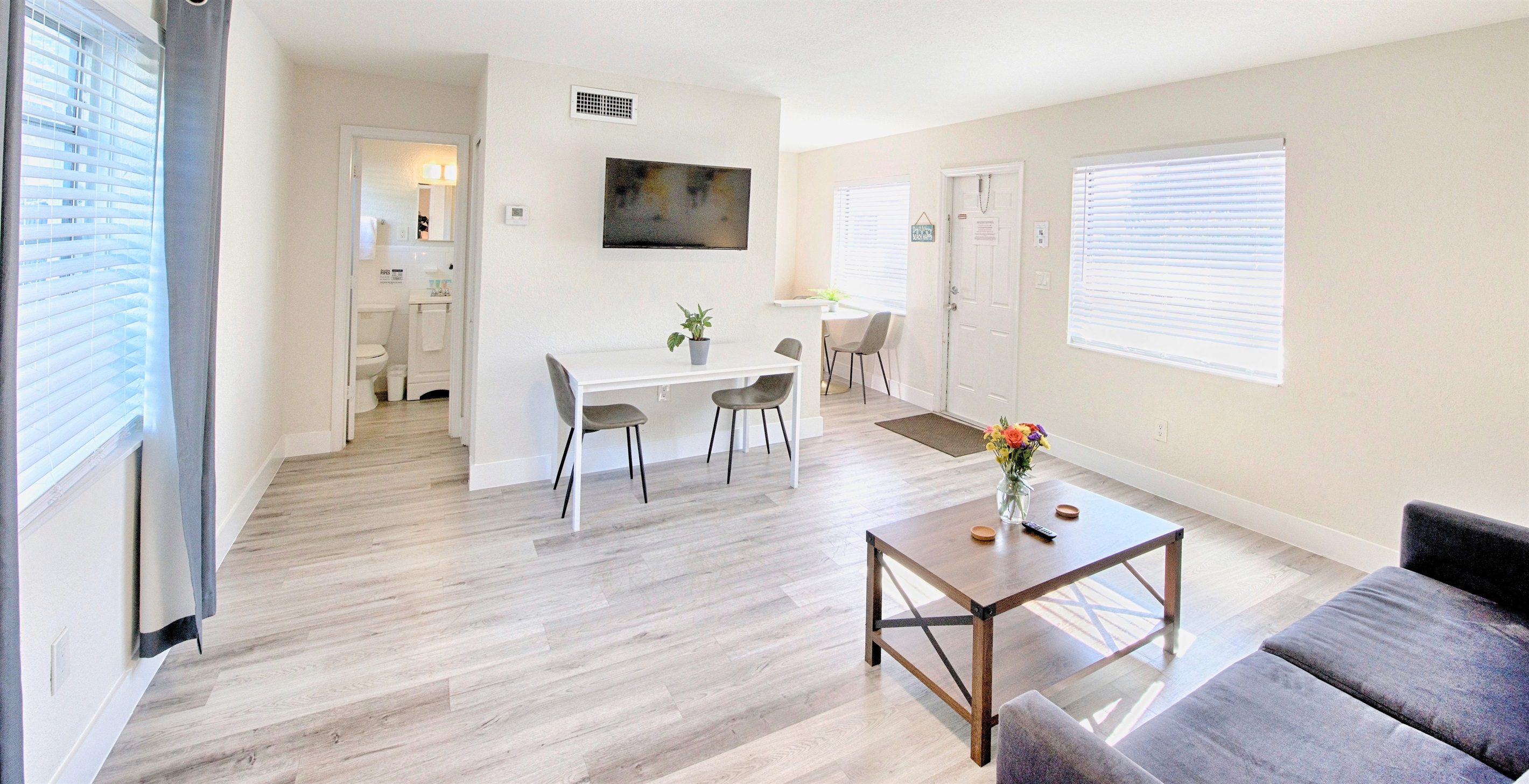 View of living room towards apartment entry