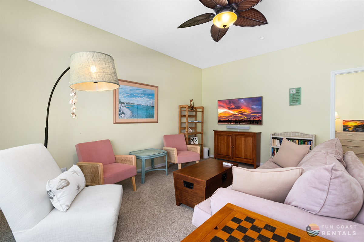 Spacious living room with ample seating and Smart TV