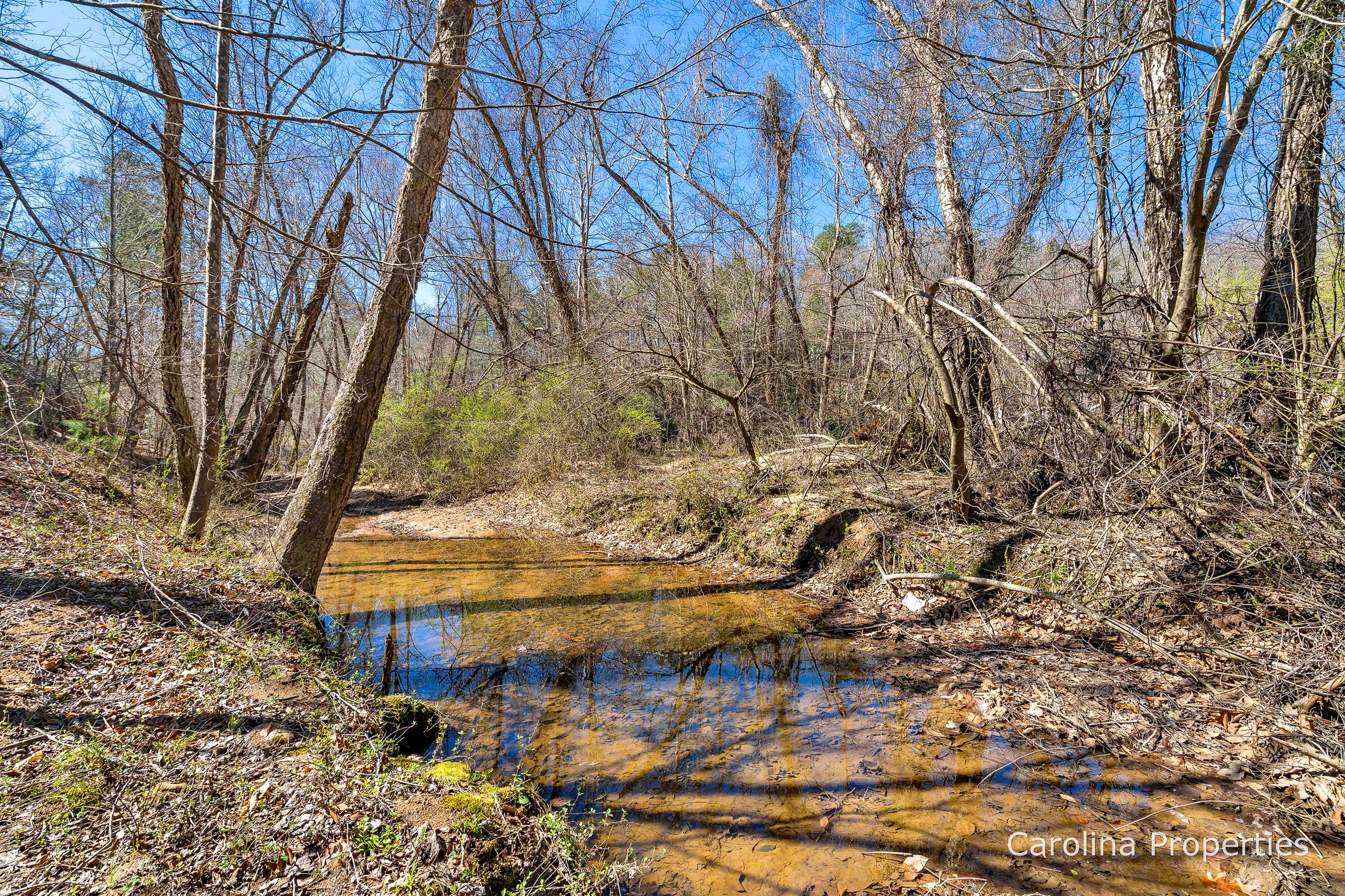 Small Creek at the bottom of the hill.  Go just a bit farther to the river