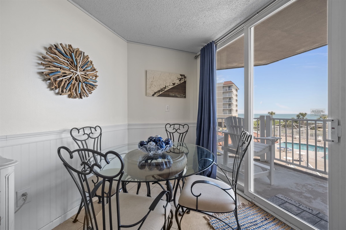 Dining nook by the window offering a bright spot for morning coffee with a view