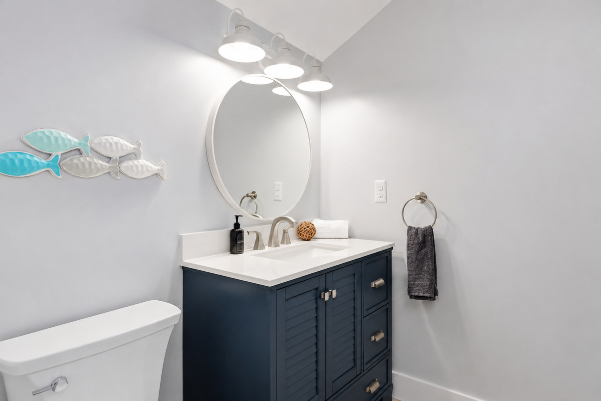 Freshen up in the third-floor full bathroom, featuring a modern vanity, bright lighting, and stylish coastal finishes designed for comfort and convenience.