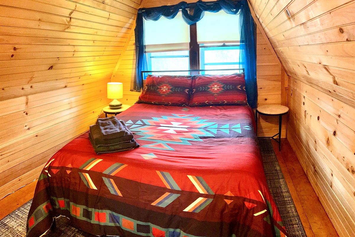 Second loft bedroom with full sized bed. Please note there is an open doorway between loft one and loft two.