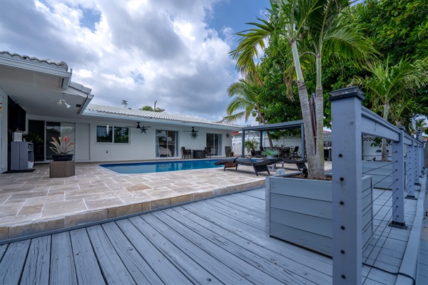 Resort-style outdoor seating area with shaded lounge