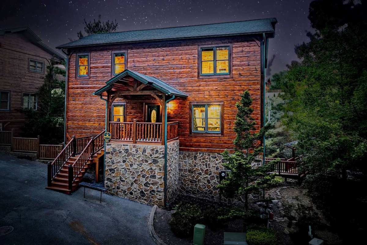 The Crown Jewel at dusk &mdash; 5-bedroom luxury cabin inside Gatlinburg Falls Parkview Resort. 3 miles from Great Smoky Mountains National Park.