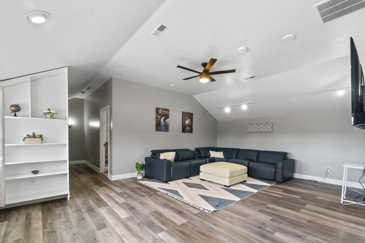 Cozy living room featuring a comfortable couch, and soft area carpet, perfect for relaxation and entertainment.