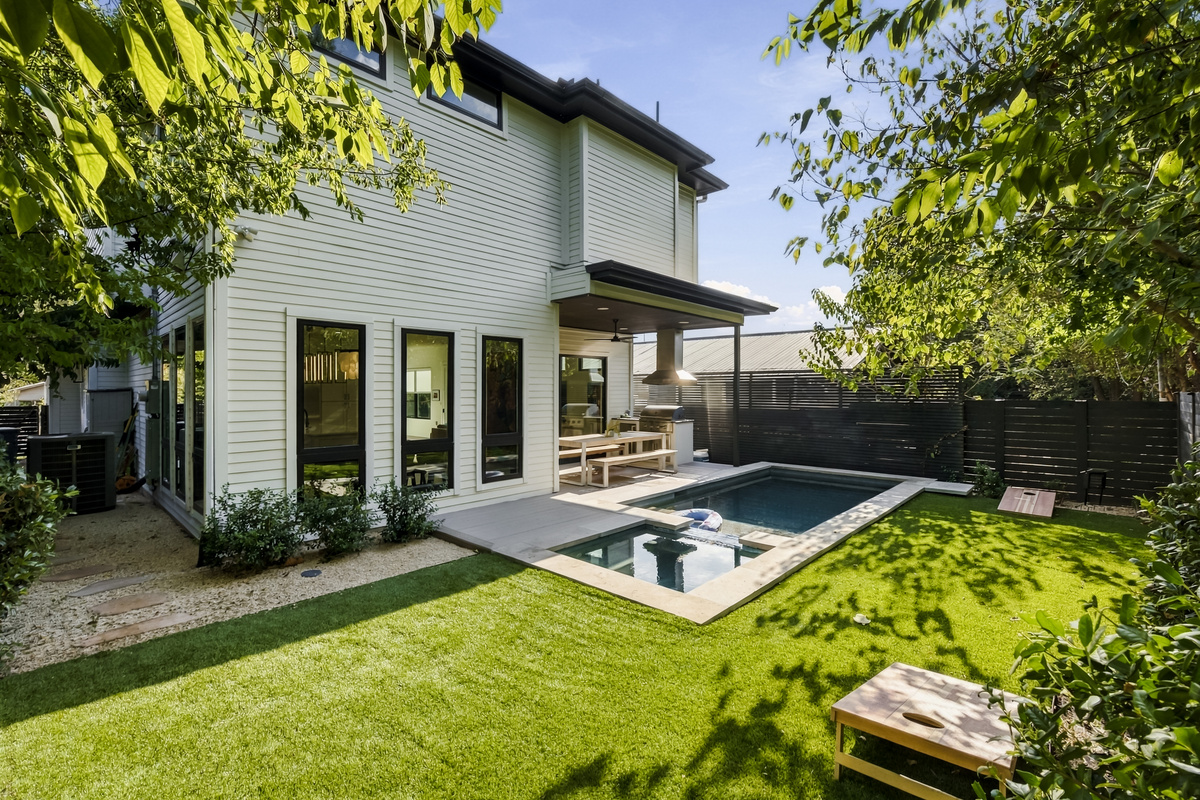 A turf backyard and sleek pool make this East Austin home an entertainer's dream.