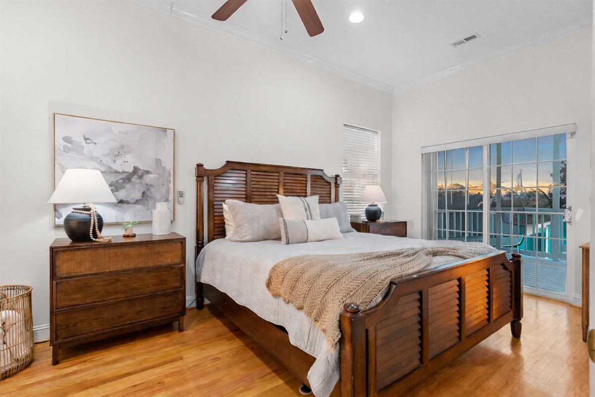 Gorgeous Master bedroom on the main level with access to the upper level back yard deck.  OH AND YOU CAN WATCH THE OCEAN FROM BED