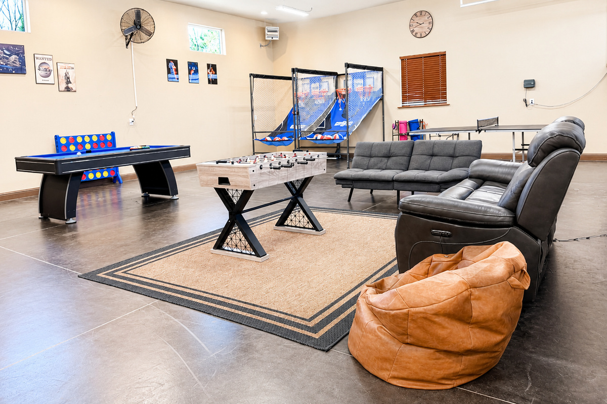 The Shop is the perfect hangout spot which features a pool table, ping pong table, foosball table, basketball arcade, a 65 inch TV, and a beverage fridge.
