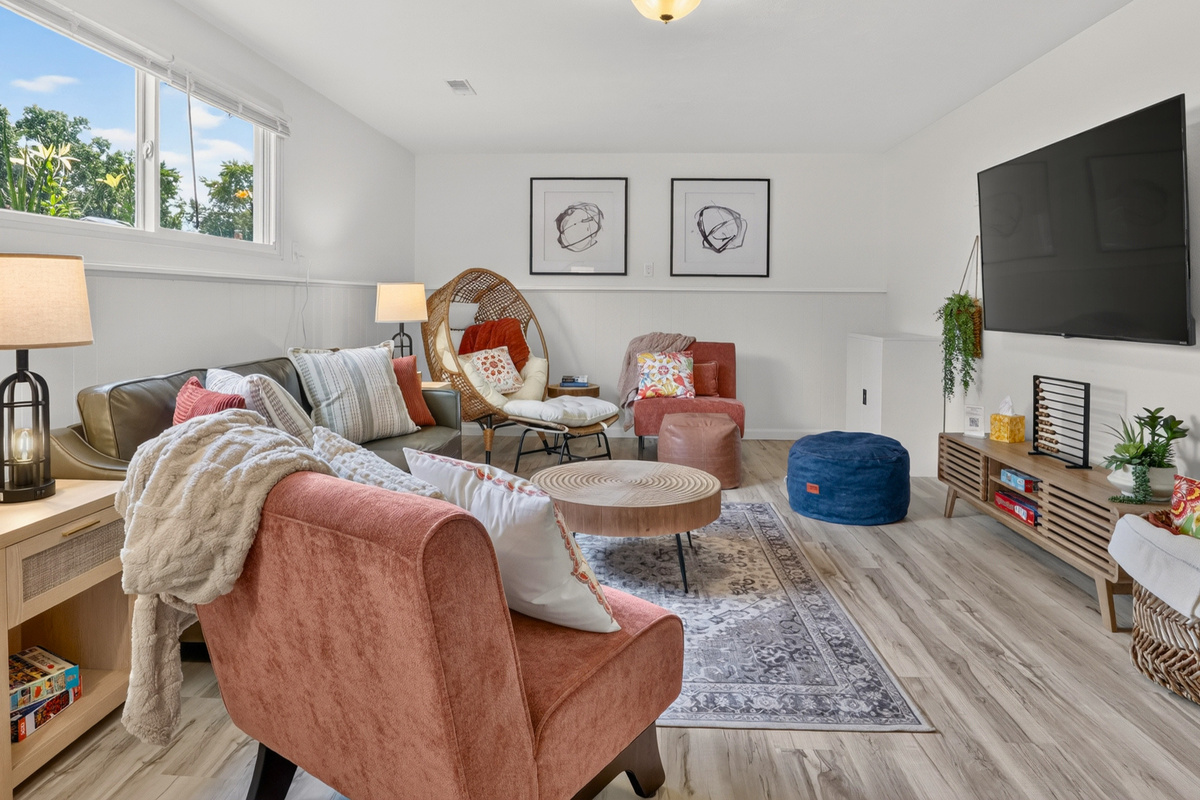 Designed for gathering with cozy seating, a 65" Smart TV, and room for everyone.