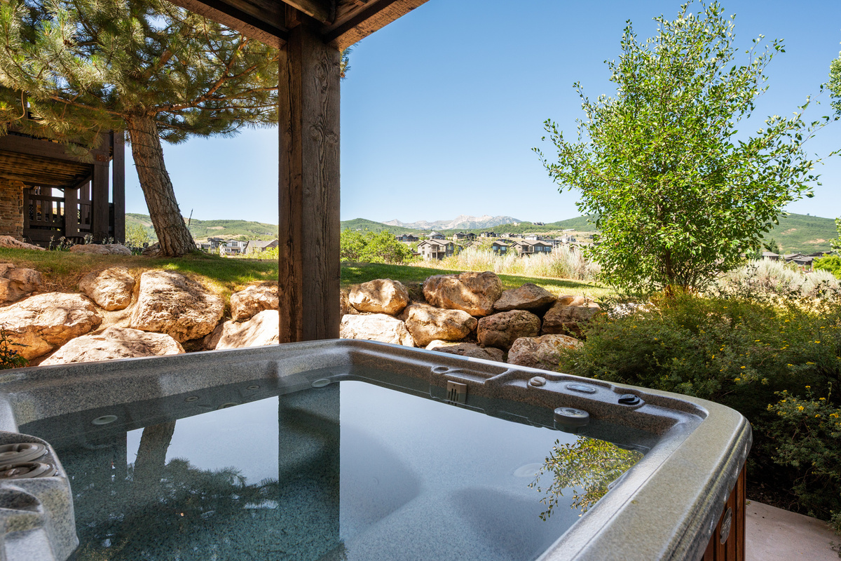 Soak in the private hot tub while taking in beautiful mountain scenery.