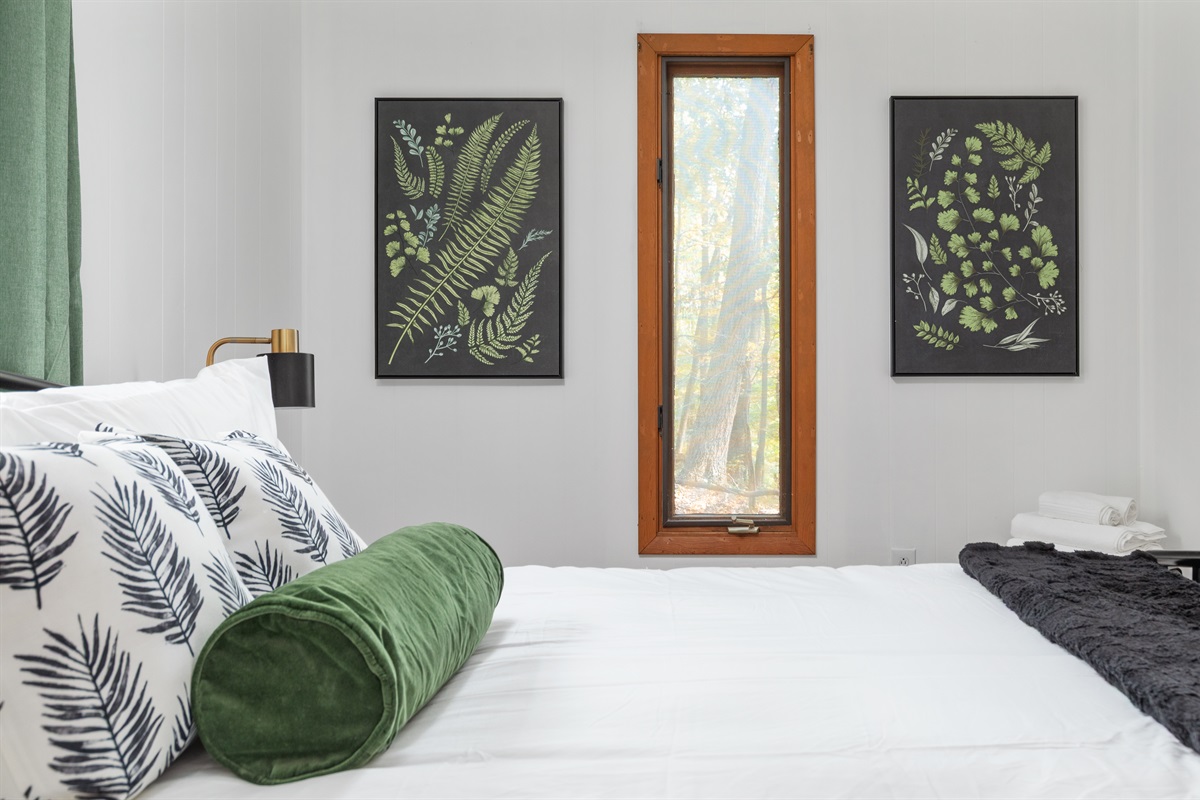 Queen bedroom with attached half bath—rest easy in comfort and style.