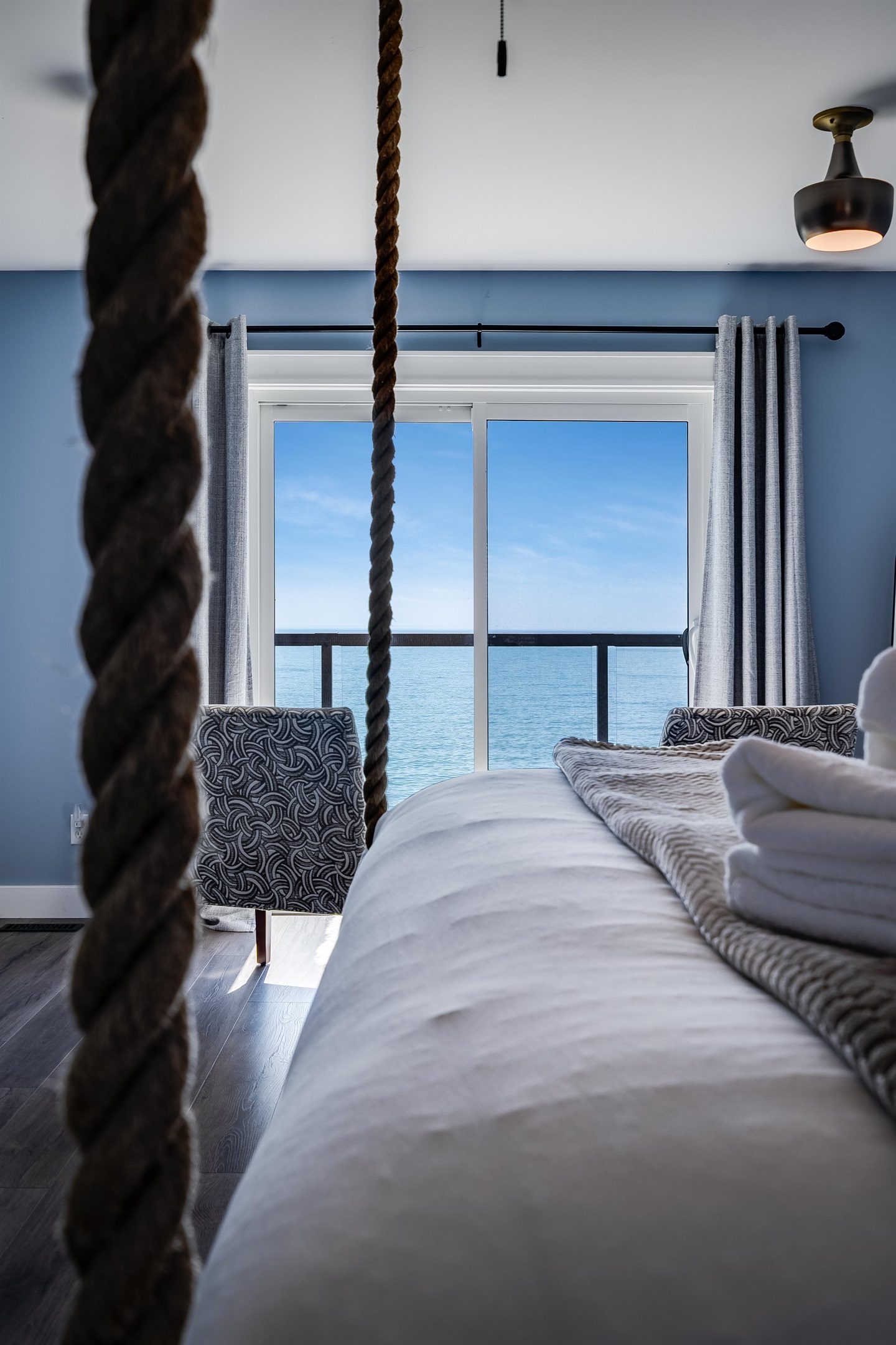 Master Bedroom with King bed and access to second story balcony with calming lake views