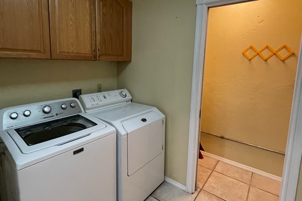The laundry room is located just off the kitchen.