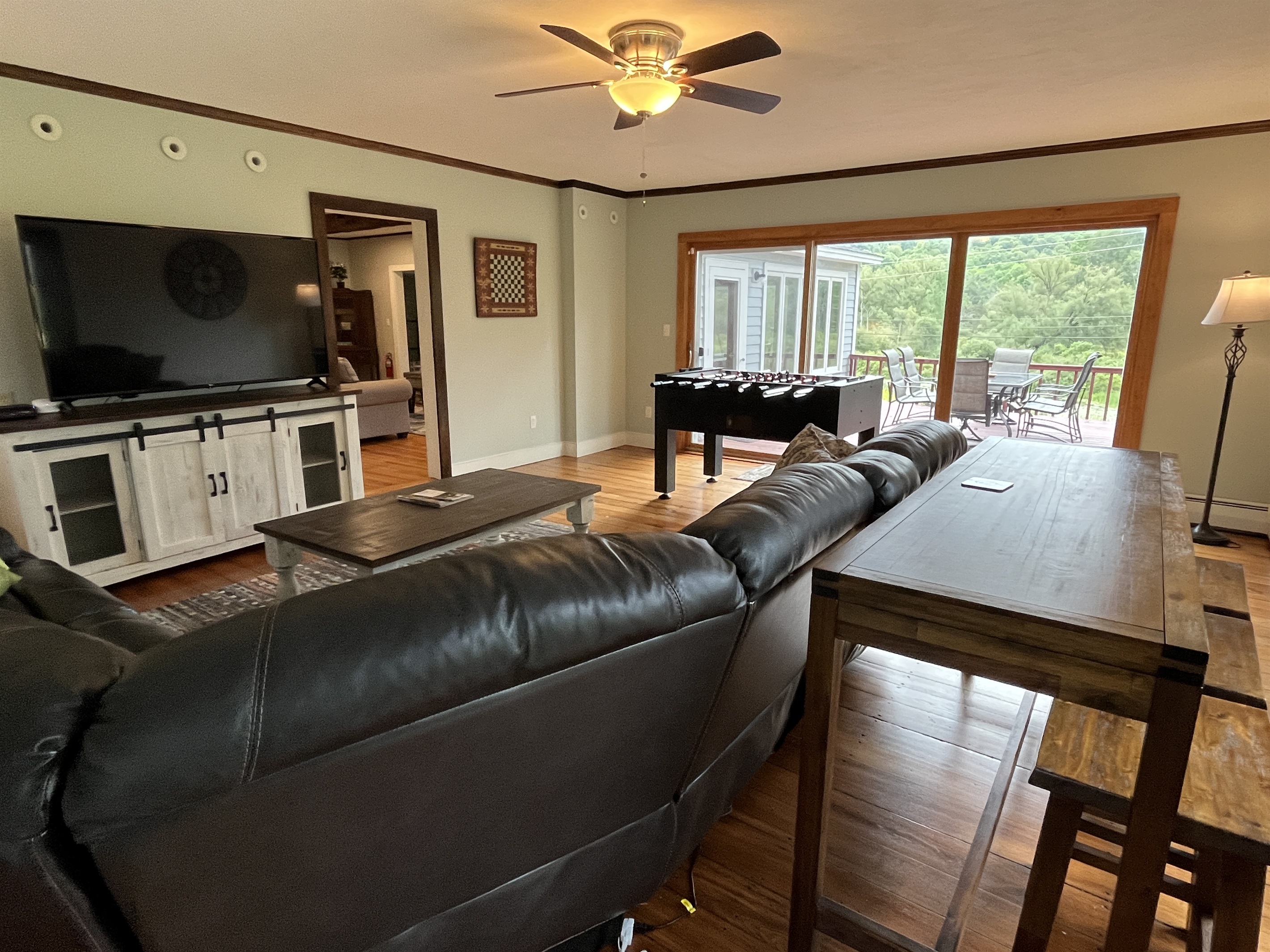 Cloverleaf Farm main living room with large sliding glass doors to the back deck.