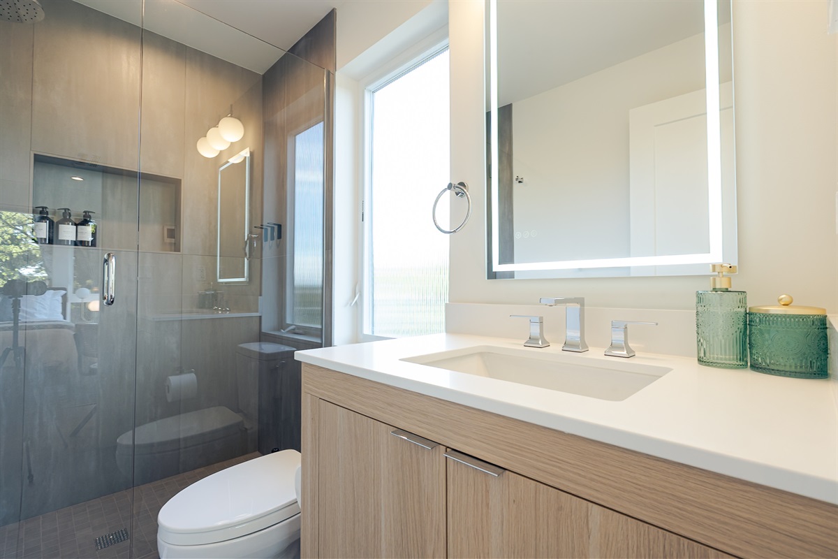 The ensuite master bathroom has a rainfall shower head and heated floors!