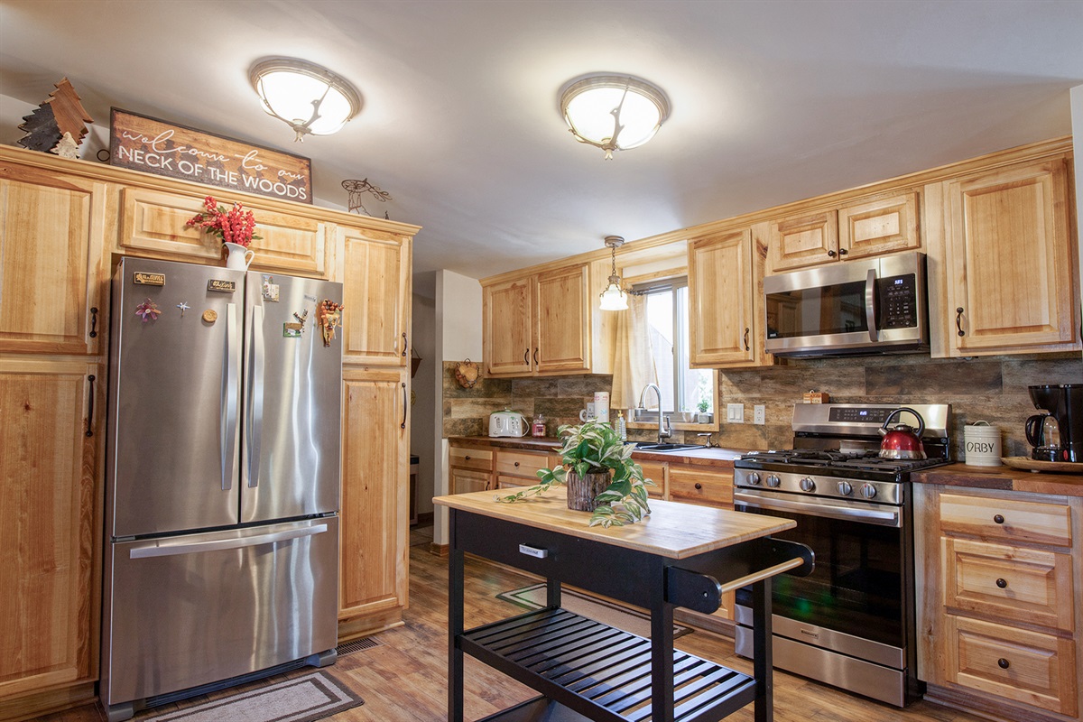 Cabin kitchen with modern comforts and rustic charm.