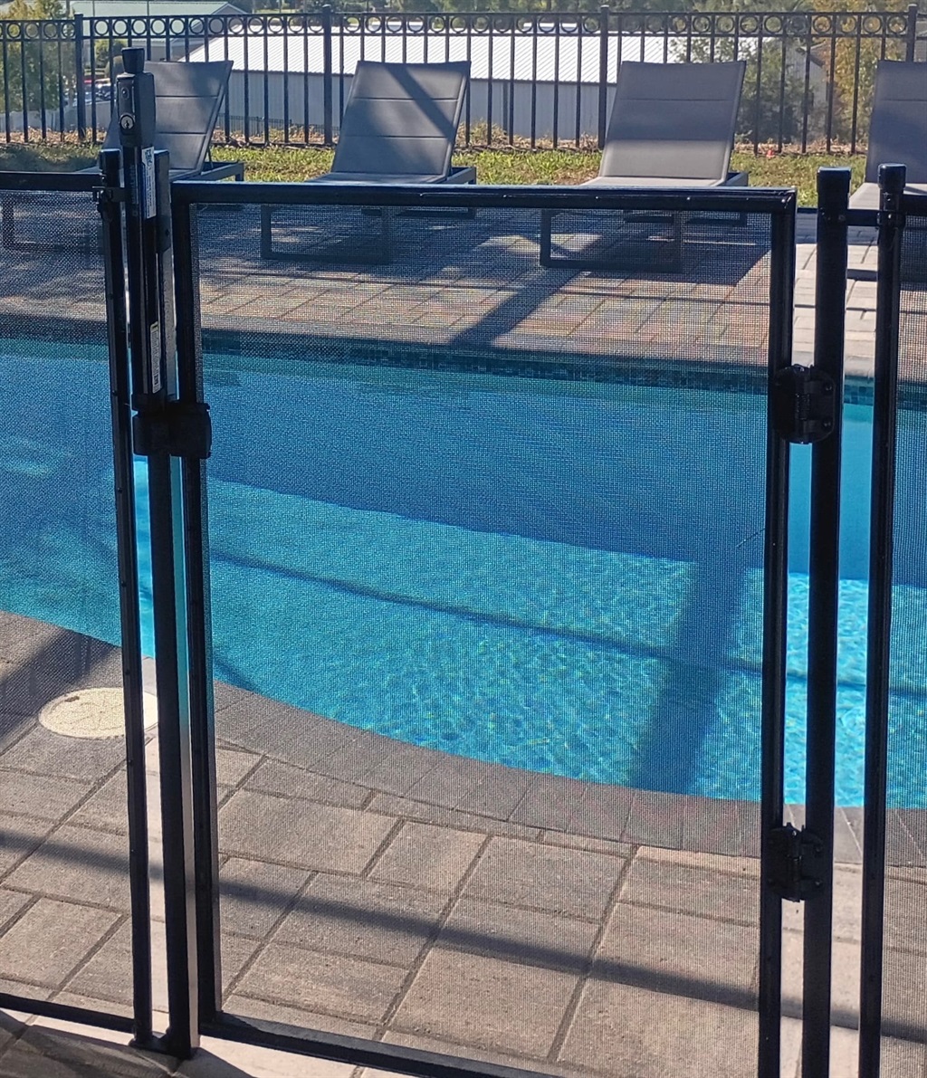 Secure gate in the pool fence