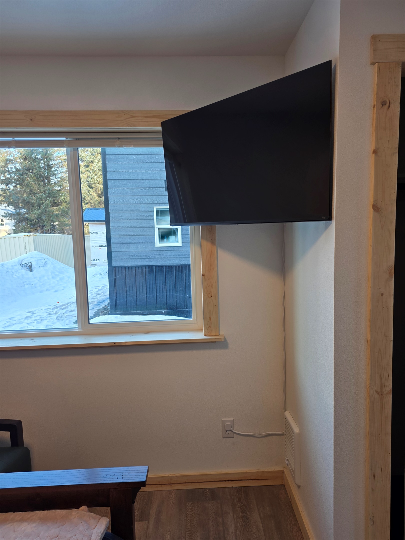 Bedroom on main floor includes a Queen Size Bed with night stand, closet space, chair and TV.