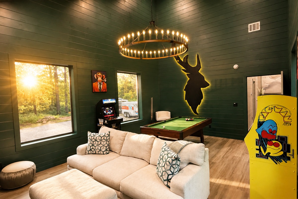 Game Room: Unwind with pool, arcade fun, and stunning forest views in vibrant surroundings!