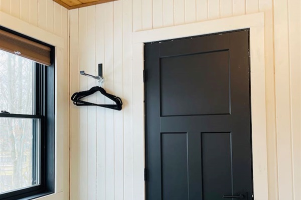 The laundry facilities are in a closet located in bedroom number one.